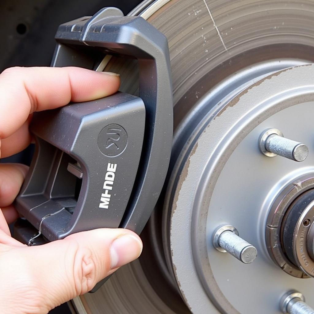 Inspecting Brake Pads on a 2000 Honda Accord