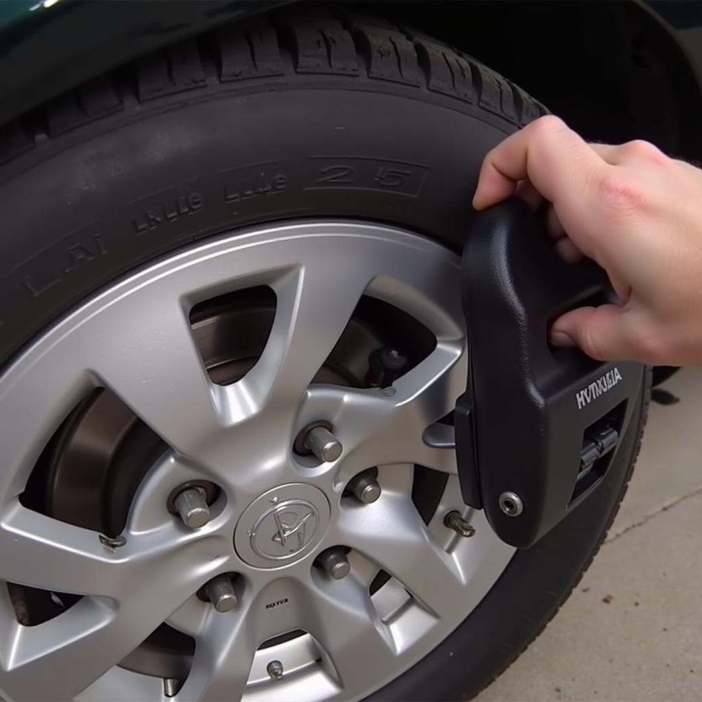 Inspecting the brake pad wear sensor on a 2005 Hyundai Elantra