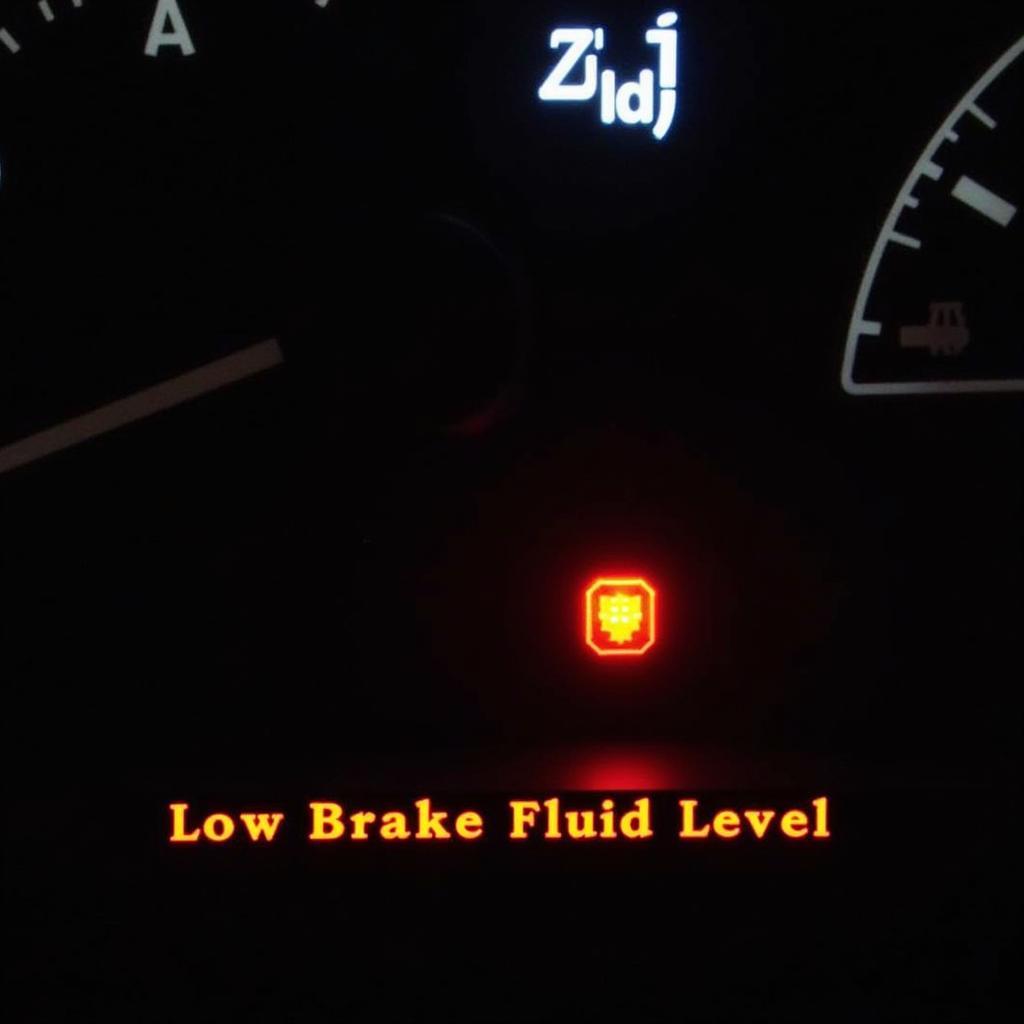 Car with low brake fluid level warning light on