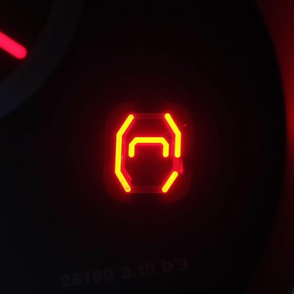 Red brake warning light illuminated on car dashboard