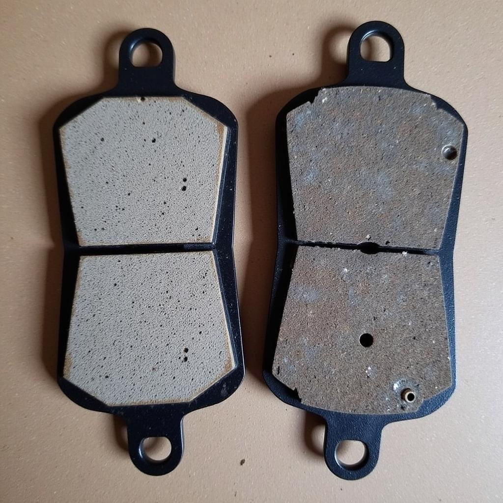 Worn Brake Pads Compared to New Ones