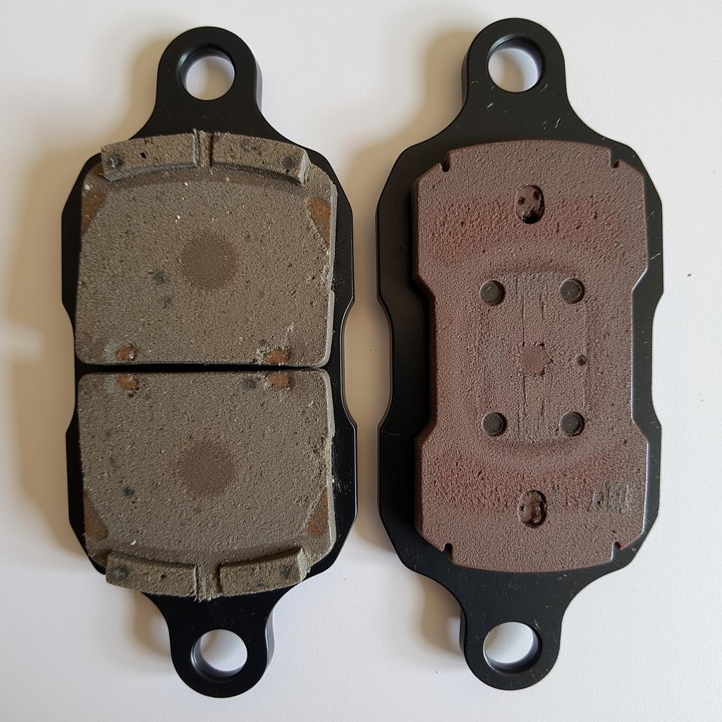 Comparison of Worn Brake Pads and New Pads